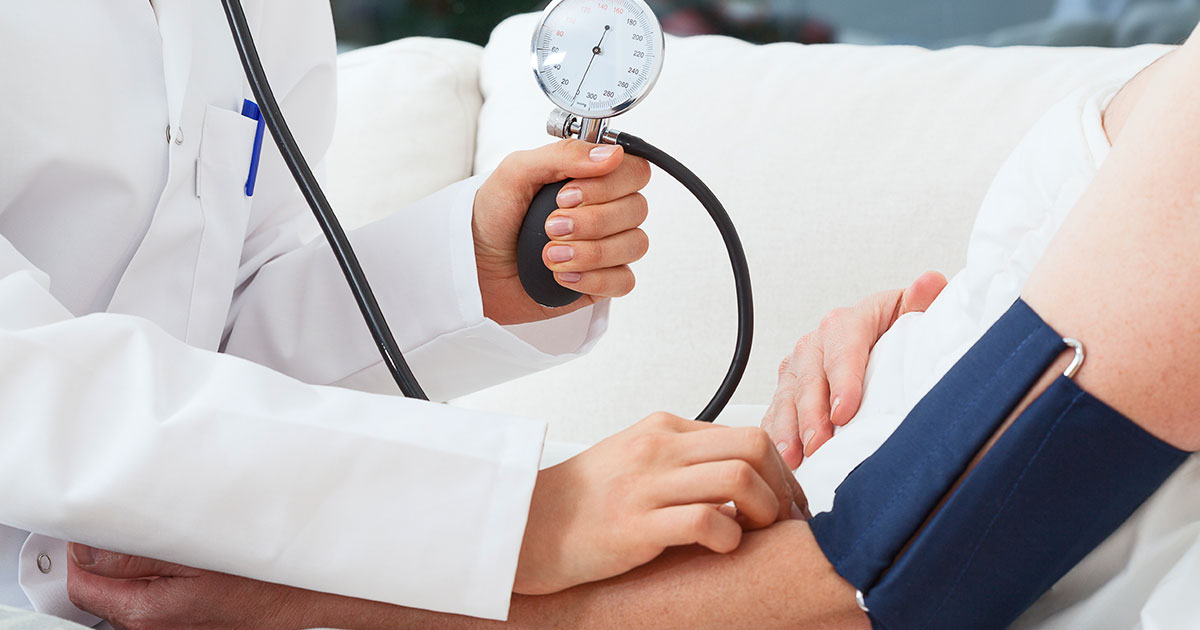 A nurse is taking a blood pressure measurement