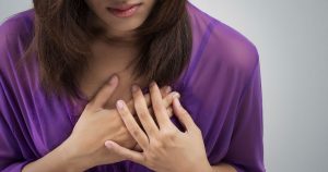 Woman is experiencing chest pain